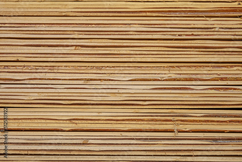 Edged board in stacks. Natural background. Texture.