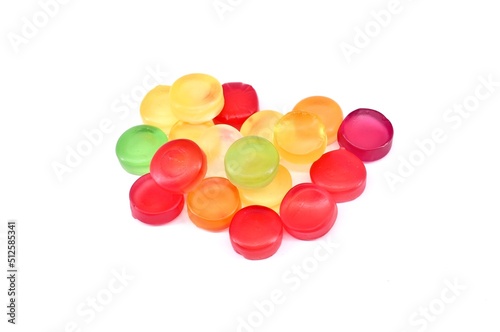 Multicolor round gummy candies on white background. photo