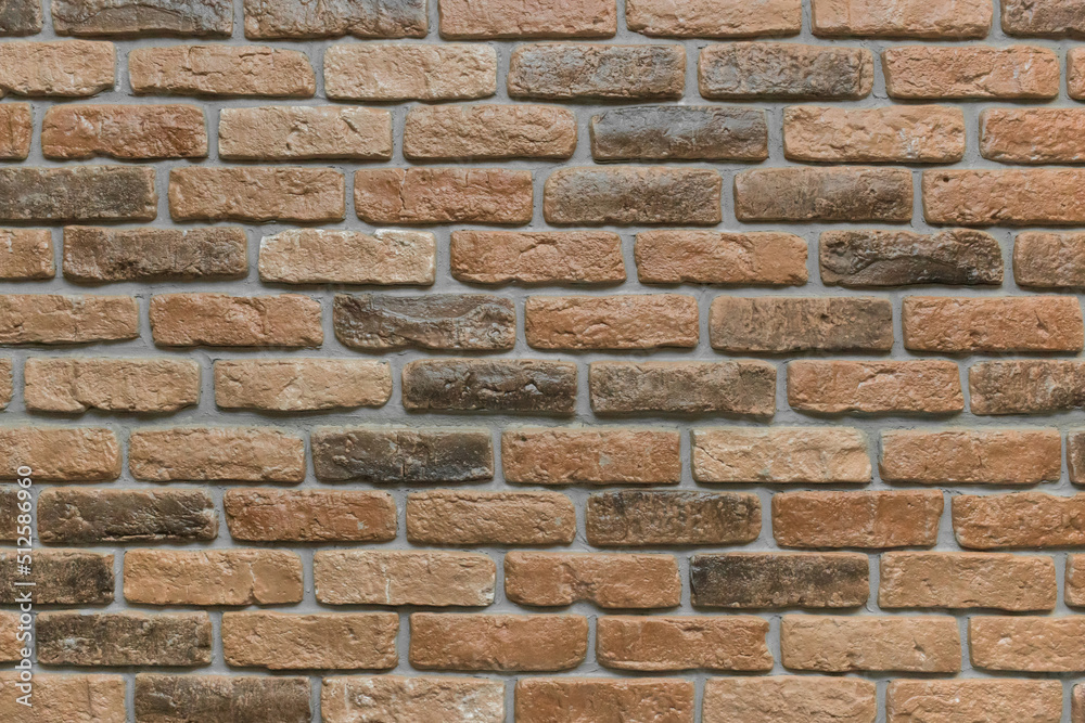 Naklejka premium Brown brick wall texture old stone background masonry rough