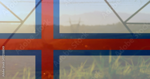 Image of flag of faroe islands over pylons