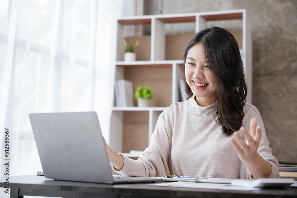 Young business women working and greeting on video conference with happy and smile face on office spec. Young business women working and greeting on video conference with happy and smile face on office spec.