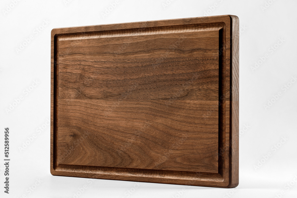 Brown wood cutting board on a white background Brown wood cutting board on a white background