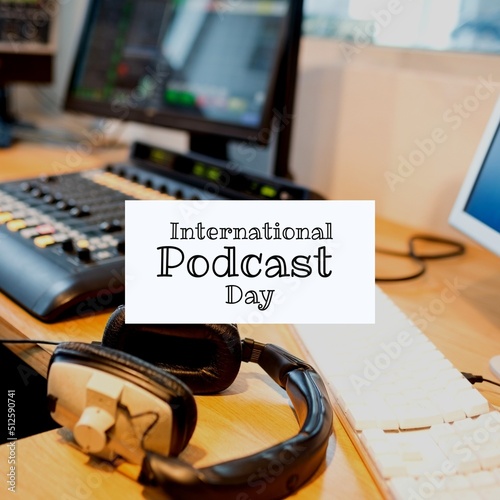 Composite of keyboard, headphones, computer and sound mixer on table and international podcast day