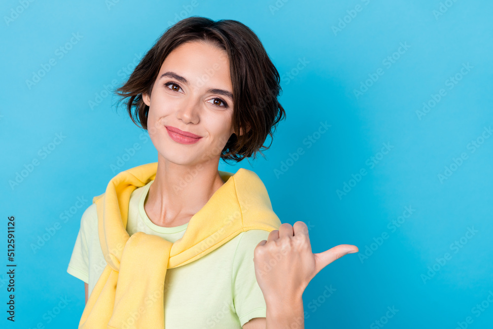 Photo of sweet millennial brunette lady index promo wear green t-shirt jumper isolated on blue color background Photo of sweet millennial brunette lady index promo wear green t-shirt jumper isolated on blue color background