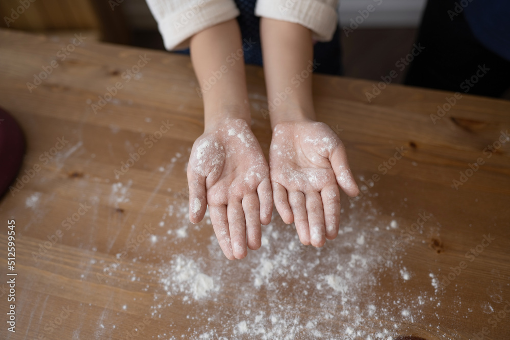 Top View Of Girl Showing Hands With Flour Top View Of Girl Showing Hands With Flour