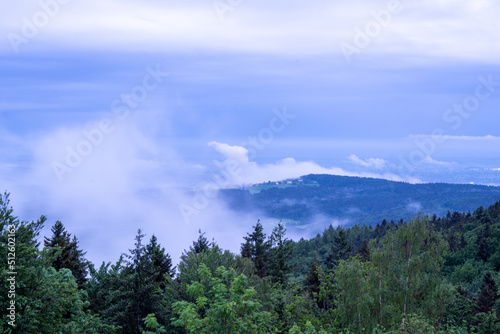 Landscape photos in the Bavarian Forest with fascinating clouds and blue sky © helfei