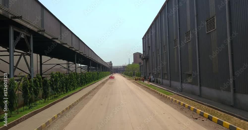 Empty Roadway In A Steel Manufacturing Plant At Dolvi Port In Maharashtra, India. dolly-in shot Empty Roadway In A Steel Manufacturing Plant At Dolvi Port In Maharashtra, India. dolly-in shot