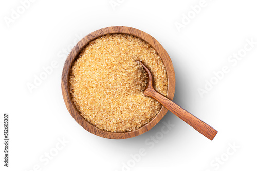 Brown sugar in wooden bowl with spoon isolated on white background, clipping path, top view, flat lay.