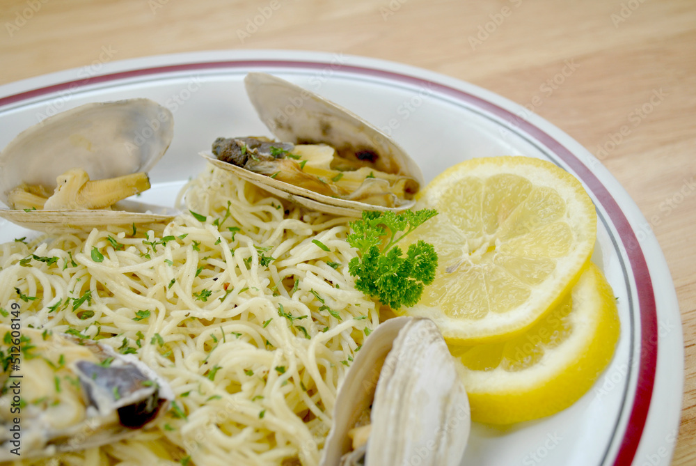 Close-Up of Gourmet Pasta with Whole Clams and Herbs Close-Up of Gourmet Pasta with Whole Clams and Herbs