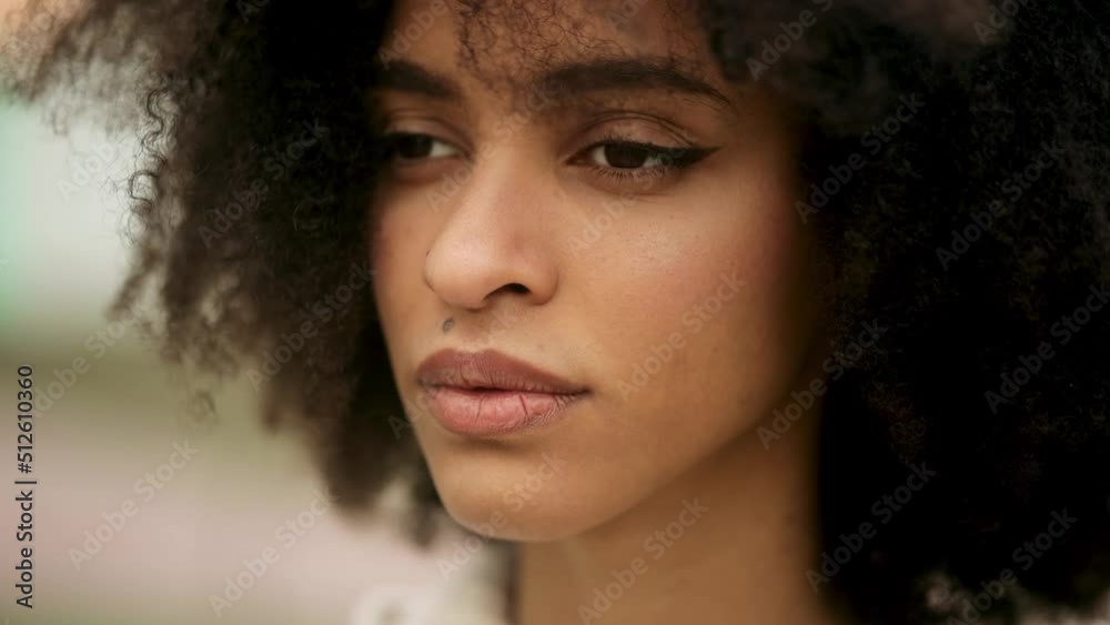 Eyes of wonderful young african american woman opening and looking straight. Gorgeous girl with long Eyelashes. Close up of woman's face at sunset, portrait, outdoor Eyes of wonderful young african american woman opening and looking straight. Gorgeous girl with long Eyelashes. Close up of woman's face at sunset, portrait, outdoor