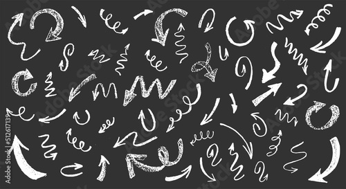 Brush stroke grunge arrows set. Up and down direction pointer. Hand drawn abstract vector illustration isolated on black chalkboard background. 