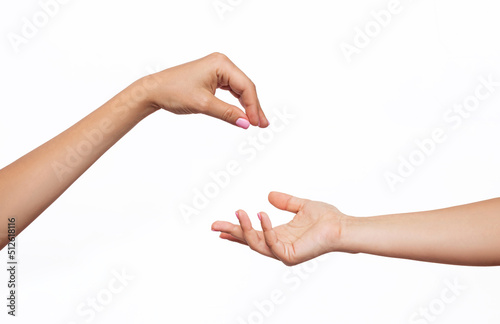 Female hand makes a gesture like handing some kind of hanging object as keys to the other outstretched hand isolated on a white background. Mockup with empty copy space for a intended object. Handover