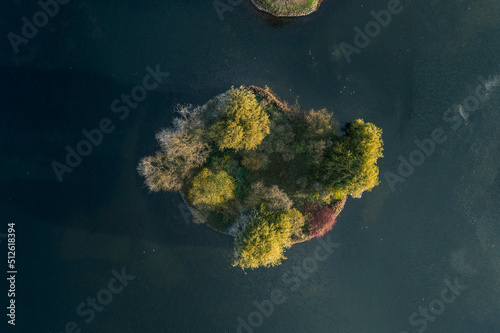 Aerial view of  a small island in a lake at pildammsparken, park in the city of Malmo in sweden in Autumn photo