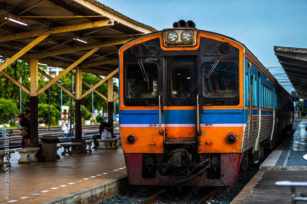 Diesel train trains with traditional public transport Thai style for commuting train approaches Phitsanulok Railway Station city in Thailand