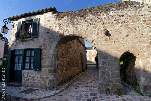 Fototapeta Naklejka Na Ścianę i Meble -  Old street in Saint-Sulpice-De -Favières village. Ile-De-France region,