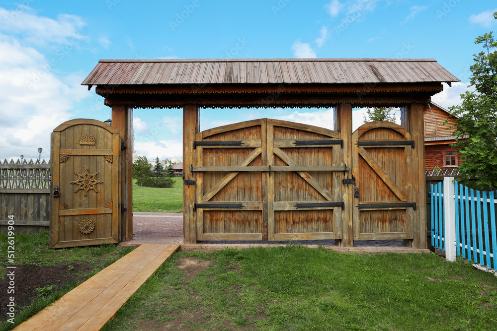 Old wooden gate with roof