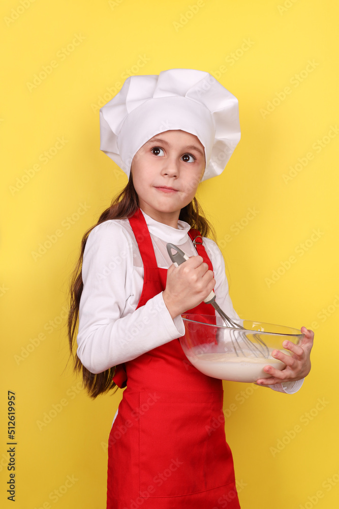chef girl kneading dough isolated on yellow background chef girl kneading dough isolated on yellow background