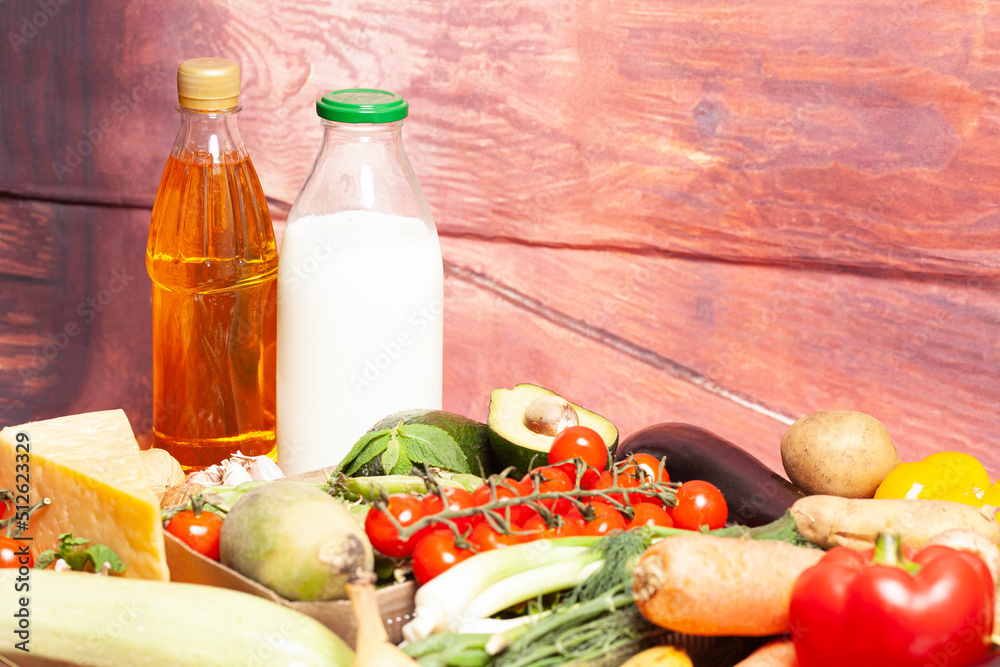Healthy food selection with fruits,vegetables,cheese,nuts, milk,spices,olive oil on wooden background Healthy food selection with fruits,vegetables,cheese,nuts, milk,spices,olive oil on wooden background