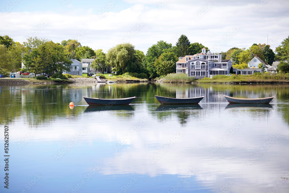 Three Rowboats on a Calm Pond