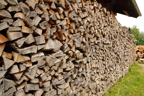 stacked dry firewood as a background 