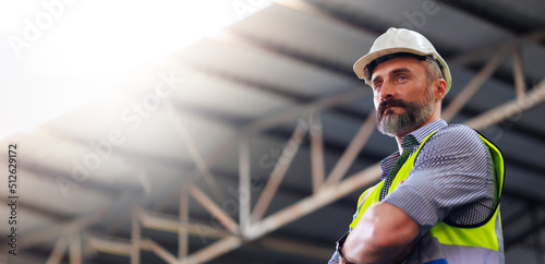 Portrait Caucasian professional Engineer factory. Engineering worker in safety hardhat at factory industrial facilities. Heavy Industry Manufacturing Factory