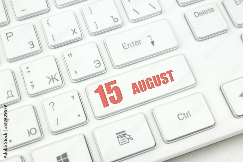 August 15th. Day 15 of month, Calendar date. Cropped view of Modern White Computer Keyboard with calendar date. Concept workspace, freelance, deadline. Summer month, day of the year concept. August 15th. Day 15 of month, Calendar date. Cropped view of Modern White Computer Keyboard with calendar date. Concept workspace, freelance, deadline. Summer month, day of the year concept.