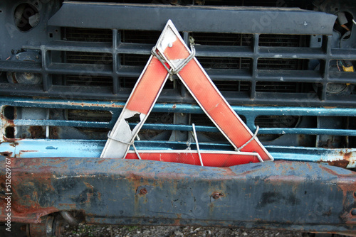 Damaged car with warning triangle