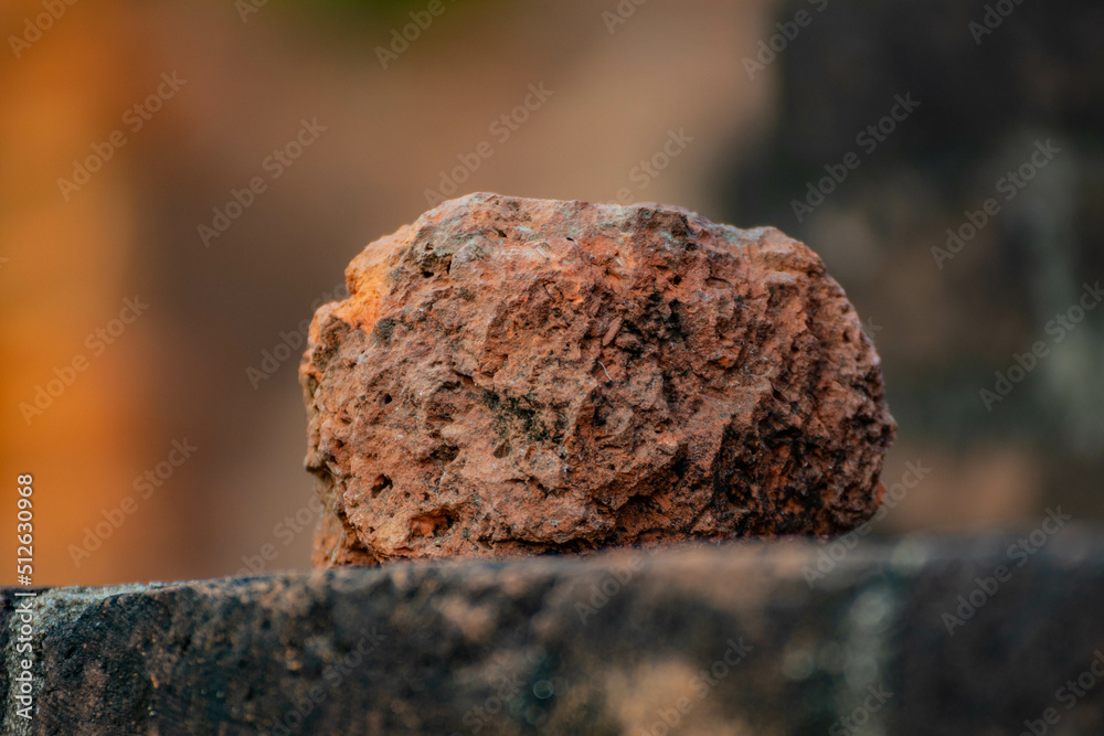 Laterite rock on the brick with blurred background. Laterite rock on the brick with blurred background.
