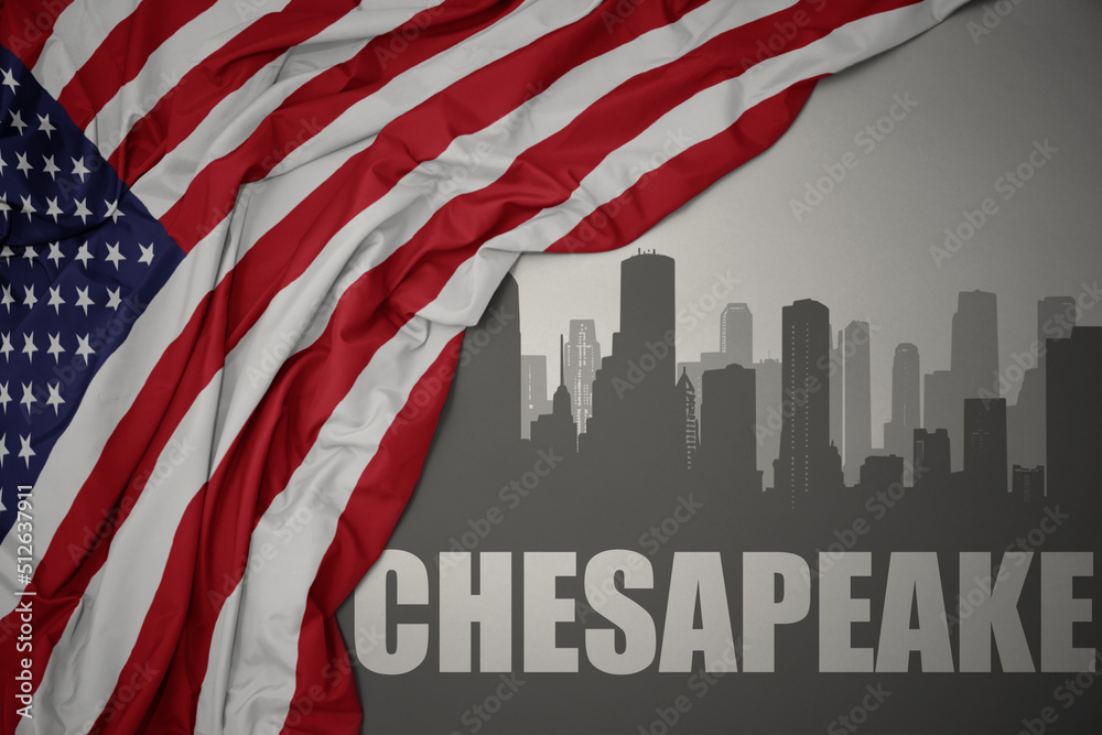 abstract silhouette of the city with text chesapeake near waving national flag of united states of america on a gray background. - obrazy, fototapety, plakaty 