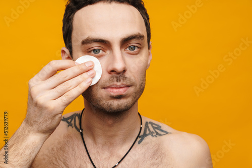 Close up portrait of a shirtless mid aged man