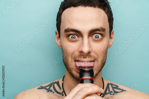 Close up portrait of a crazy middle aged shirtless man © Drobot Dean