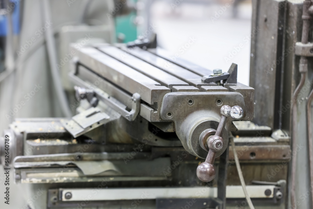 Metal working machine tool bed controls, selective focus. Metal working machine tool bed controls, selective focus.