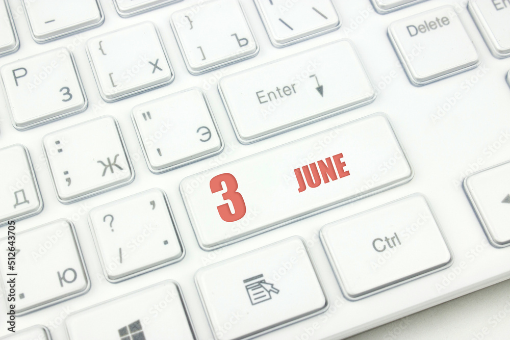 June 3rd. Day 3 of month, Calendar date. Cropped view of Modern White Computer Keyboard with calendar date. Concept workspace, freelance, deadline. Summer month, day of the year concept. June 3rd. Day 3 of month, Calendar date. Cropped view of Modern White Computer Keyboard with calendar date. Concept workspace, freelance, deadline. Summer month, day of the year concept.