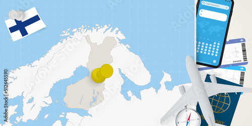 Travel to Finland concept, map with pin on map of Finland. Vacation preparation map, flag, passport and tickets.
