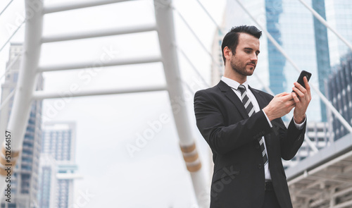 Business caucasian men present attractive lifestyle and working outdoors. Businessman work via smart phone social distance online. Concept of people communication and technology digital.