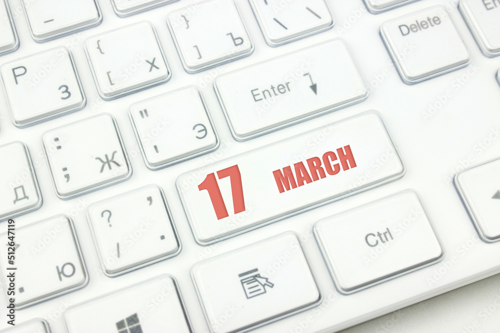 March 17th. Day 17 of month, Calendar date. Cropped view of Modern White Computer Keyboard with calendar date. Concept workspace, freelance, deadline. Spring month, day of the year concept. March 17th. Day 17 of month, Calendar date. Cropped view of Modern White Computer Keyboard with calendar date. Concept workspace, freelance, deadline. Spring month, day of the year concept.