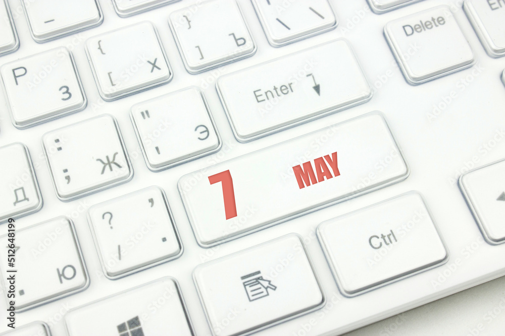 May 7th. Day 7 of month, Calendar date. Cropped view of Modern White Computer Keyboard with calendar date. Concept workspace, freelance, deadline. Spring month, day of the year concept. May 7th. Day 7 of month, Calendar date. Cropped view of Modern White Computer Keyboard with calendar date. Concept workspace, freelance, deadline. Spring month, day of the year concept.