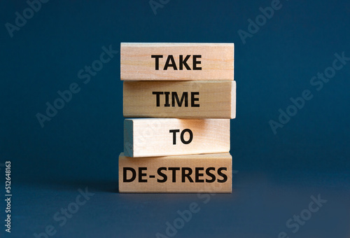 Take time to de-stress symbol. Concept words Take time to de-stress on wooden blocks. Beautiful grey table grey background. Psychological business and take time to de-stress concept. Copy space. photo