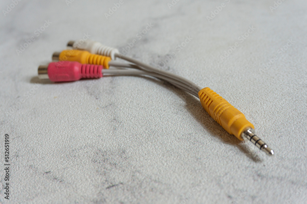 RCA cable in white background. Red Yellow White cable male to female to
