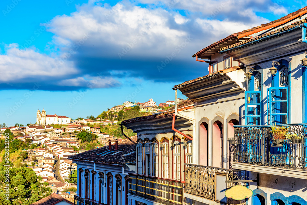 Old colonial style houses and baroque church lit by the afternoon sun in the historic town of Ouro Preto in Minas Gerais