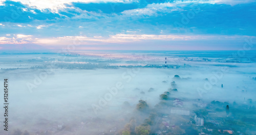 Morning fog  Ukrainian village covered with fog  drone view  aerial photography