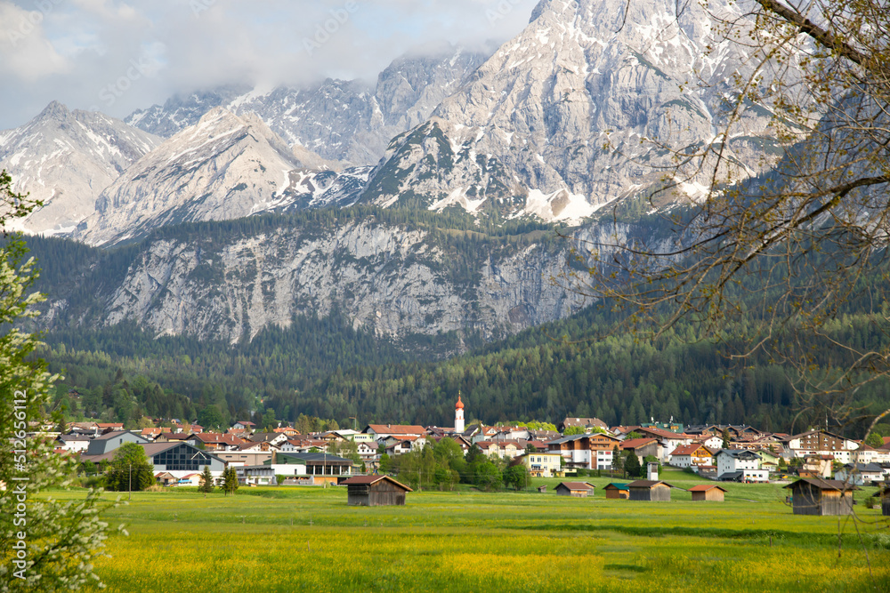 Beautilful green meadow and alpine village in spring, Austria