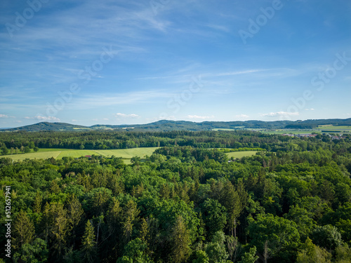 Aerial shot of forest and hills in background © CAN_Aerials