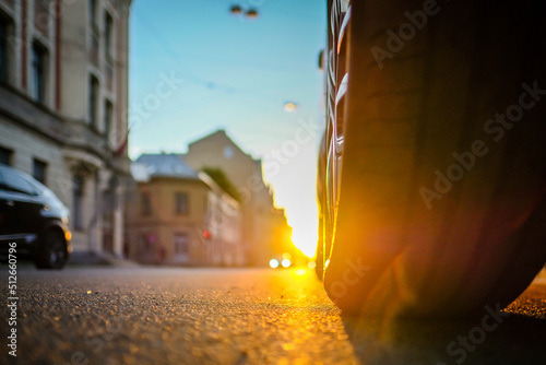 Sunset in the city and car, traffic in the city. Defocused