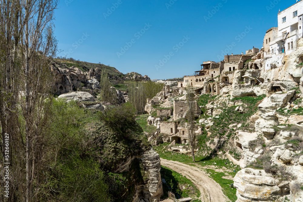 View of Ortahisar town, old houses, rock formations and walking routes. Cappadocia, Nevsehir Province., Turkey.
