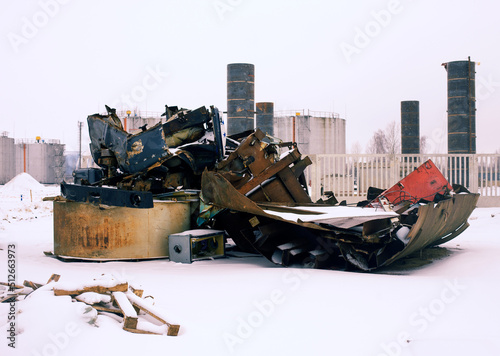 rusty car parts piled up for recycling