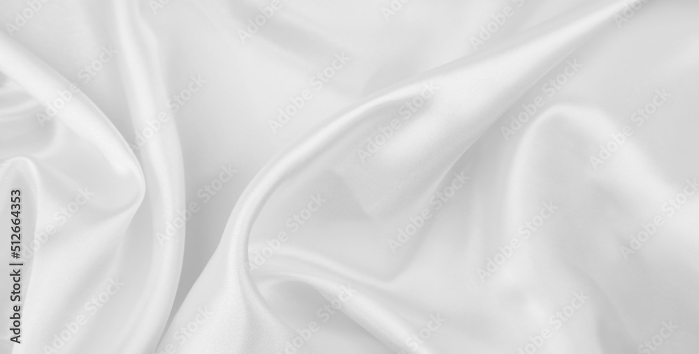 Close-up of rippled white silk fabric texture background
