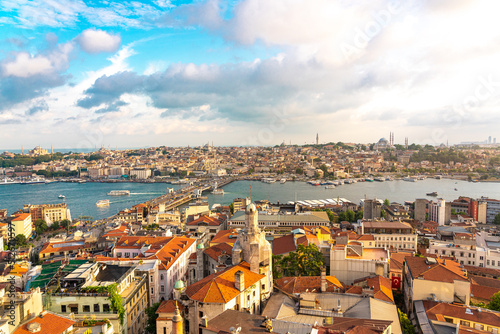 Istanbul skyline at sunset, Turkey. Panoramic view of Galata bridge, Golden Horn and old Fatih district