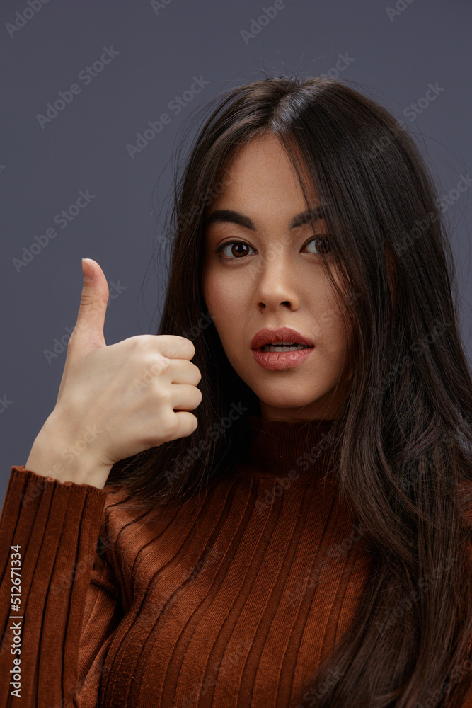 portrait woman brown sweater glamor posing smile fashion Gray background portrait woman brown sweater glamor posing smile fashion Gray background