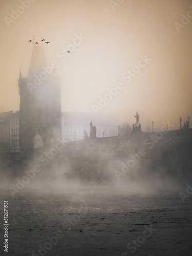 Fotobehang sunrise over the Charles bridge with mist in Prague